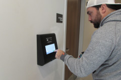 Man Using Package Room Kiosk