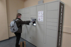 Student Retrieving Items from Package Locker