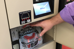 Man retrieving BOPIS order from Automated Retail Locker