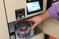 Man retrieving BOPIS order from Automated Retail Locker Man retrieving BOPIS order from Automated Retail Locker