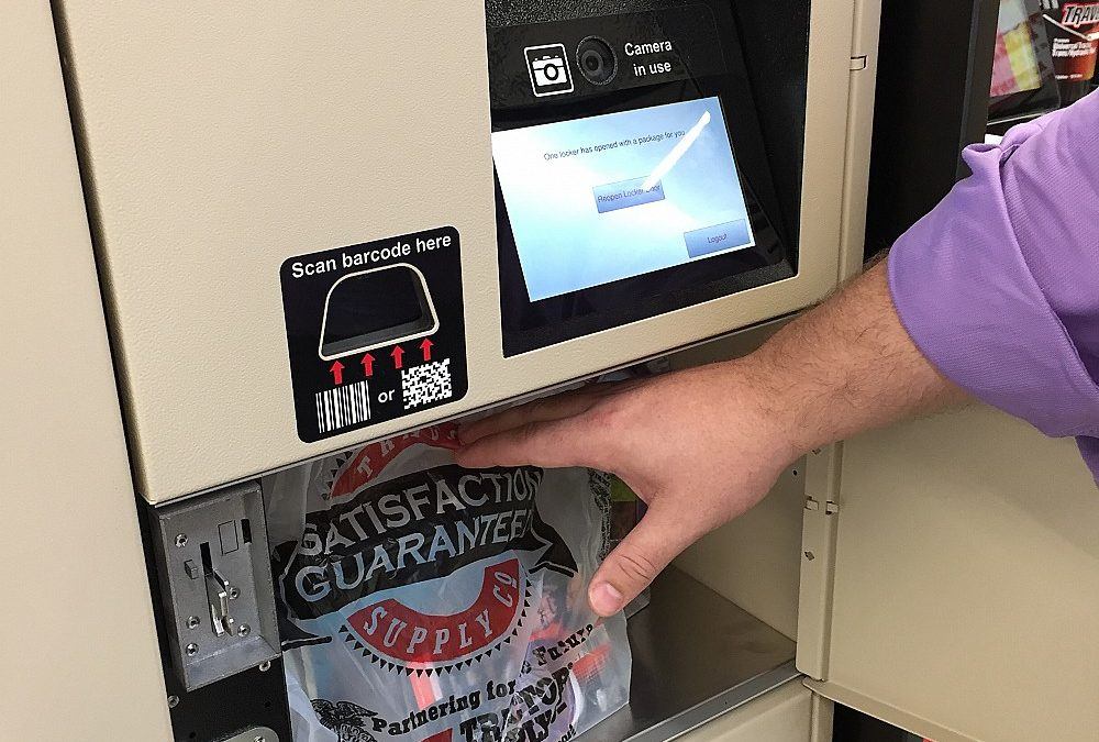 male hand retrieving order from electronic retail locker
