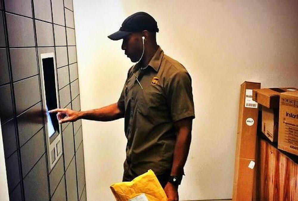UPS carrier delivering package to automated package locker