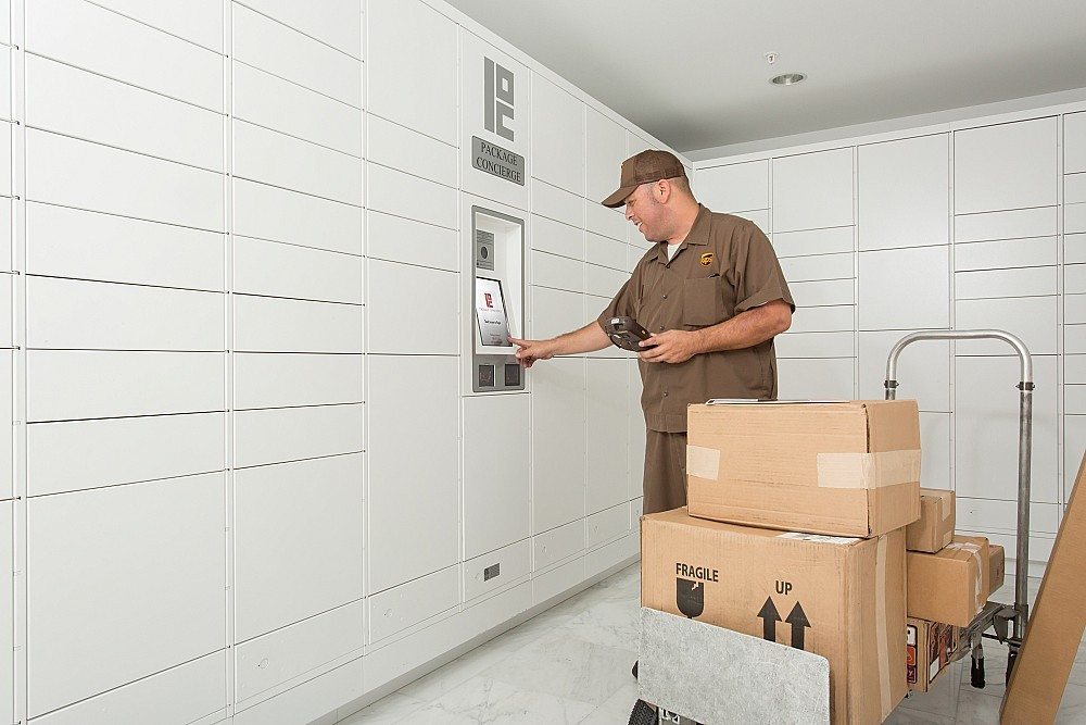 UPS carrier delivering packages to automated package locker
