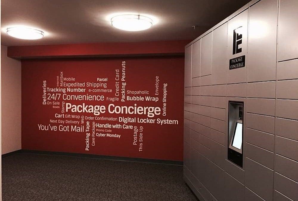 Automated locker next to wall with word cloud