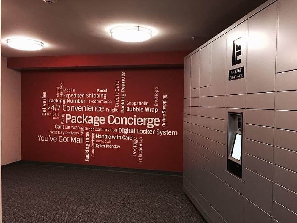 Automated locker next to wall with word cloud