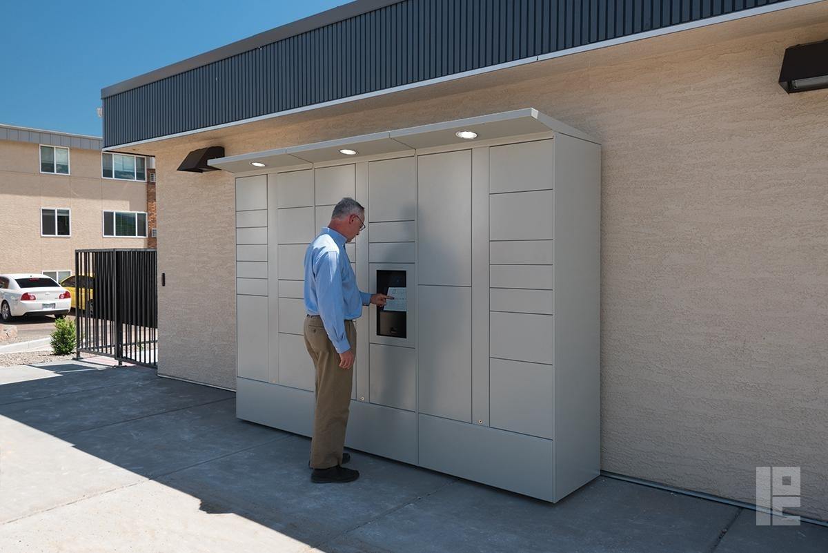 man using outdoor package locker