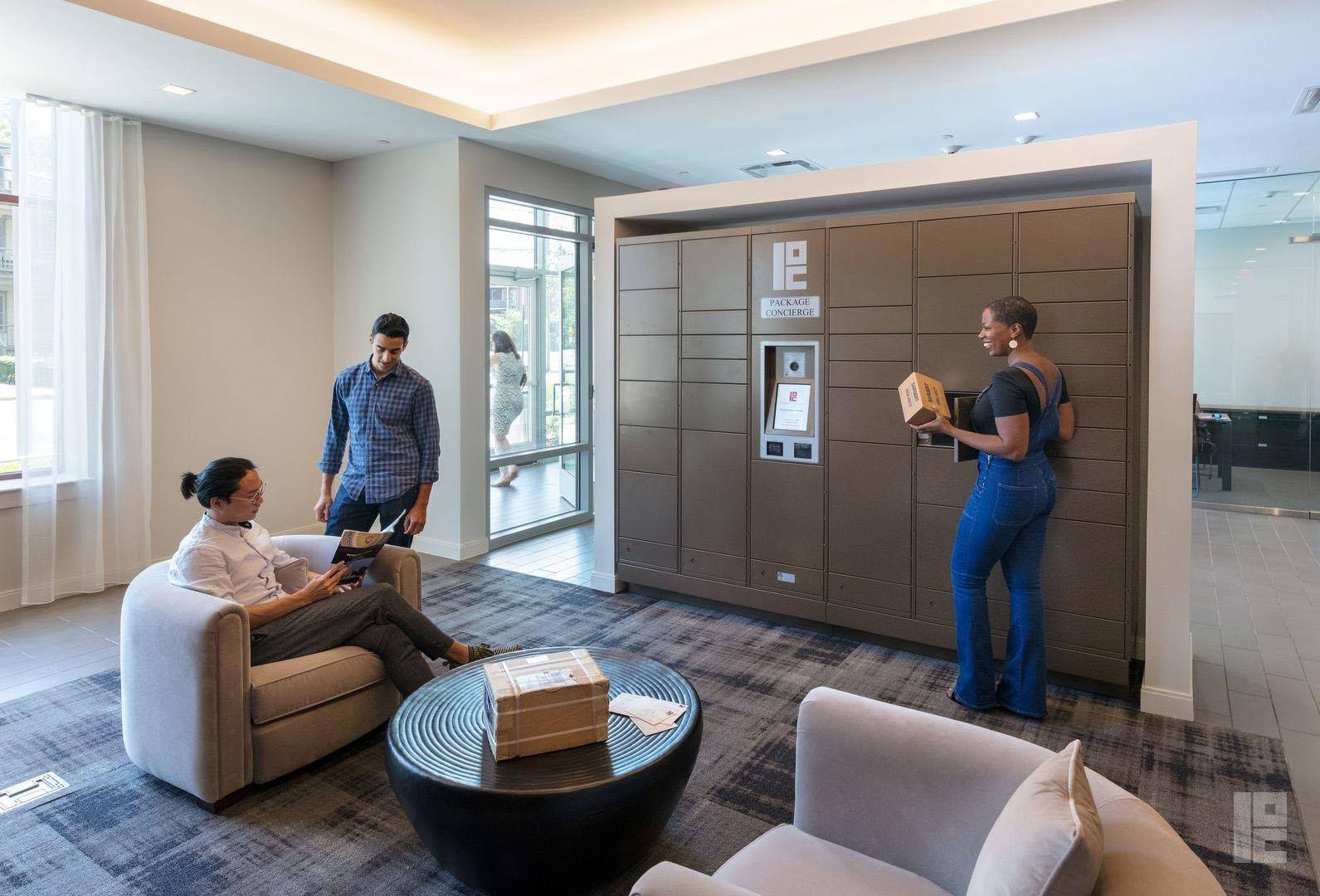 smiling residents retrieving their packages from the smart locker system