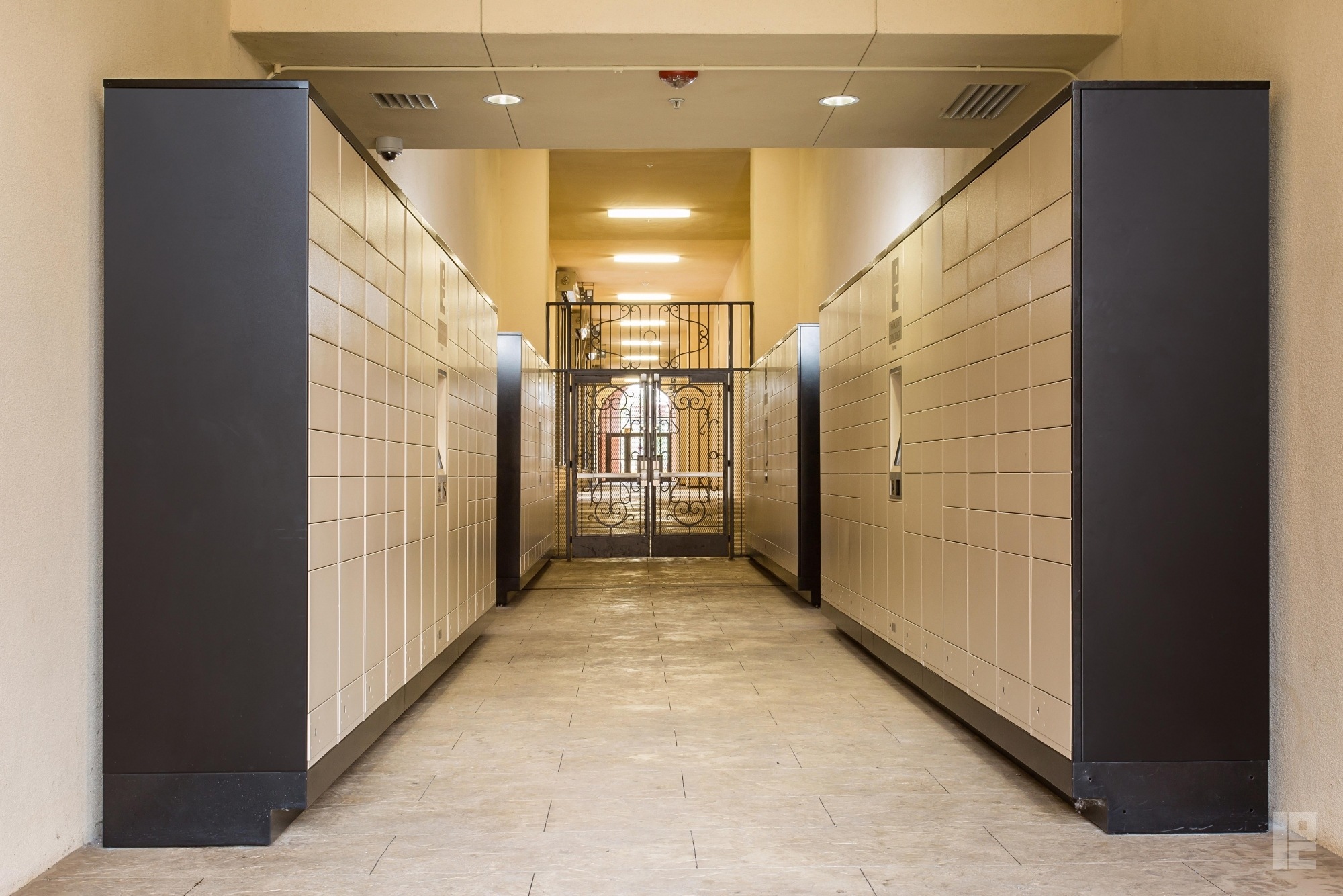 tan and dark brown package lockers on opposite walls for student housing in Los Angeles