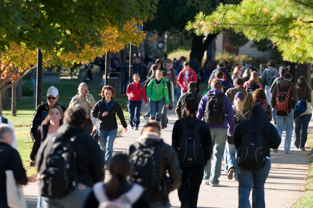 People walking across a university campus
