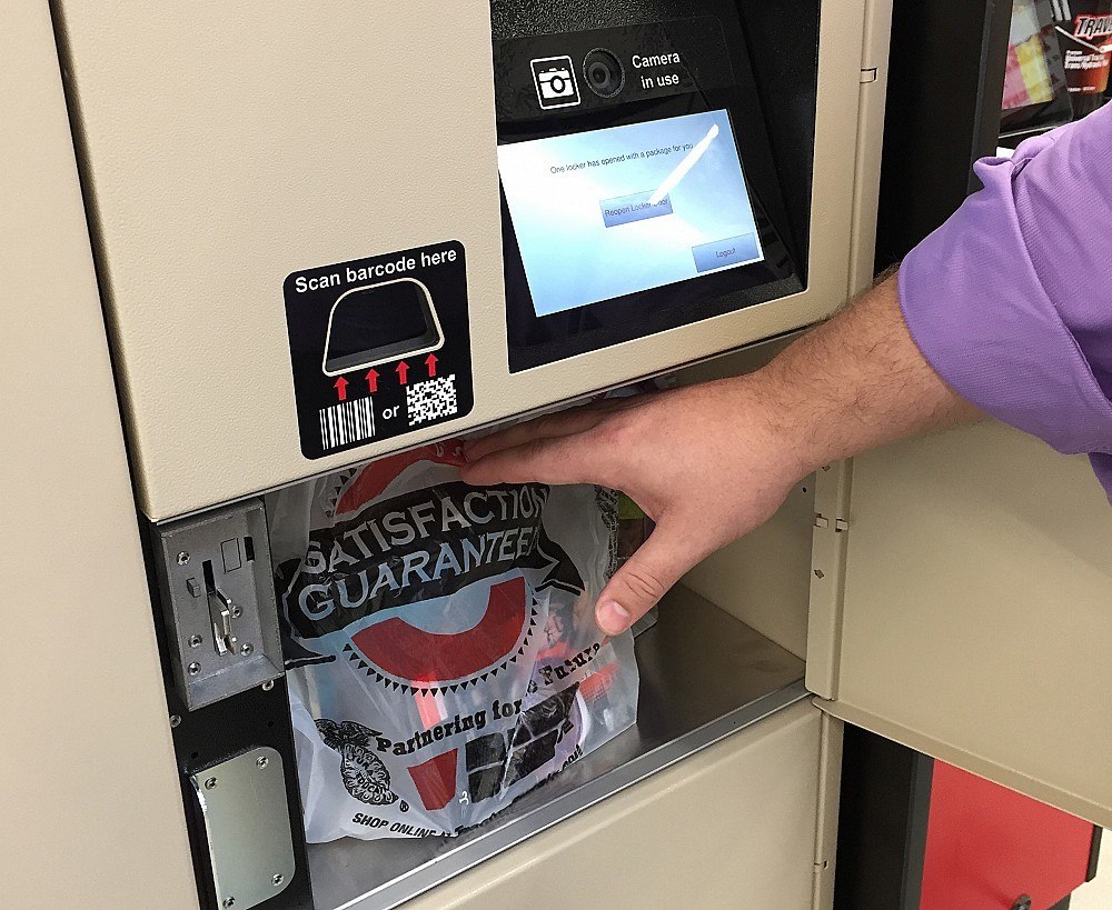 male arm reaching for package inside locker compartment